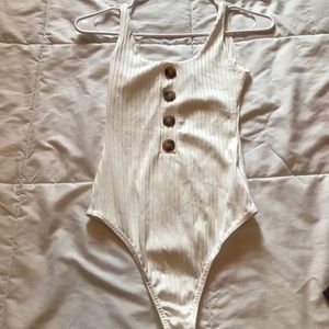 Pretty little thing. Small. Bodysuit
